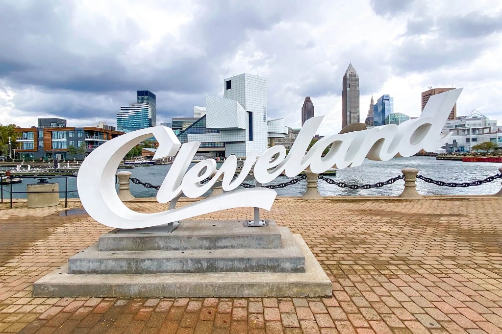 The Cleveland script sign at North Coast Harbor, with the downtown skyline across the water